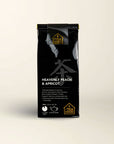 100g pack of black tea flavoured with peach and apricot, from The Tea House