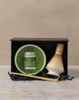 Matcha gift set in gift box including ceremonial matcha powder, ceramic green bowl, bamboo spoon, bamboo whisk, ceramic whisk holder, by The Tea House