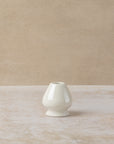 White ceramic stand for matcha whisk, by The Tea House