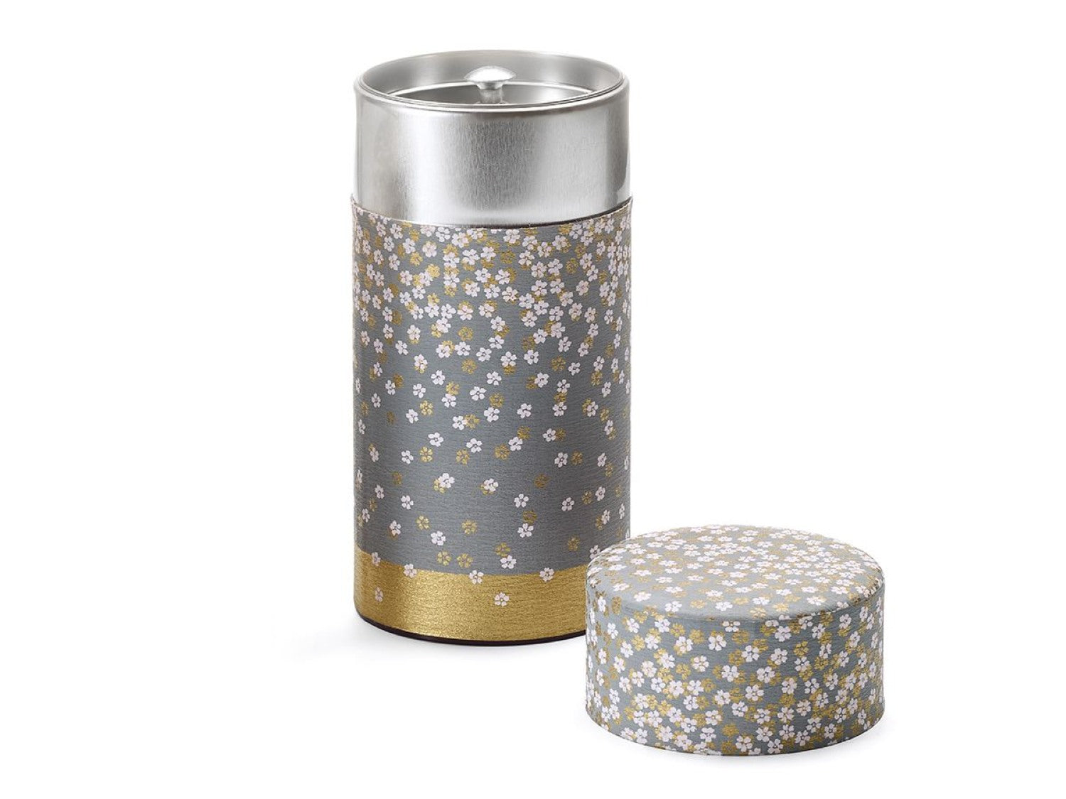 Cylindrical tea caddy including inner airtight lid, with white and gold Japanese blossom pattern on blue background in two sizes (90g and 150g)