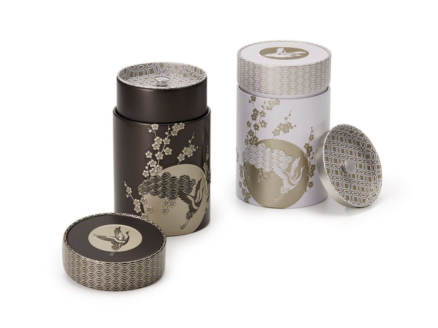 Pair of cylindrical tea canisters, elaborately decorated with crane and cherry blossom design with matching airtight inner lids 