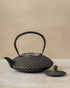 1.2 litre decorative cast iron teapot with stainless steel mesh filter basket, by The Tea House