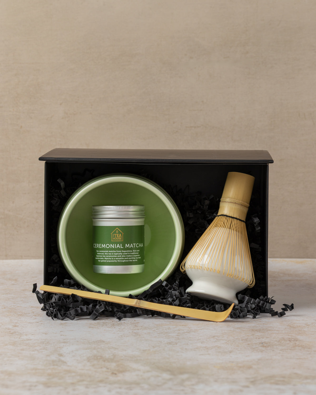 Matcha set gift wrapped including ceremonial matcha powder, ceramic green bowl, bamboo spoon, bamboo whisk, ceramic whisk holder