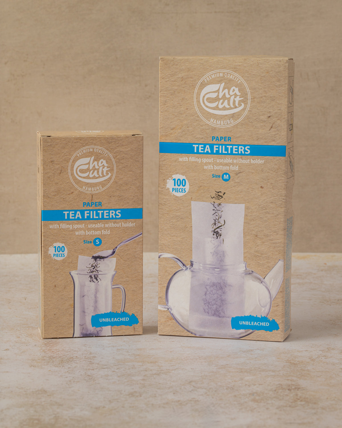 Boxes of 100 paper tea filters in two sizes, by The Tea House