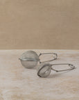 Stainless steel tea infuser tong with long sprung handle in two sizes, by The Tea House