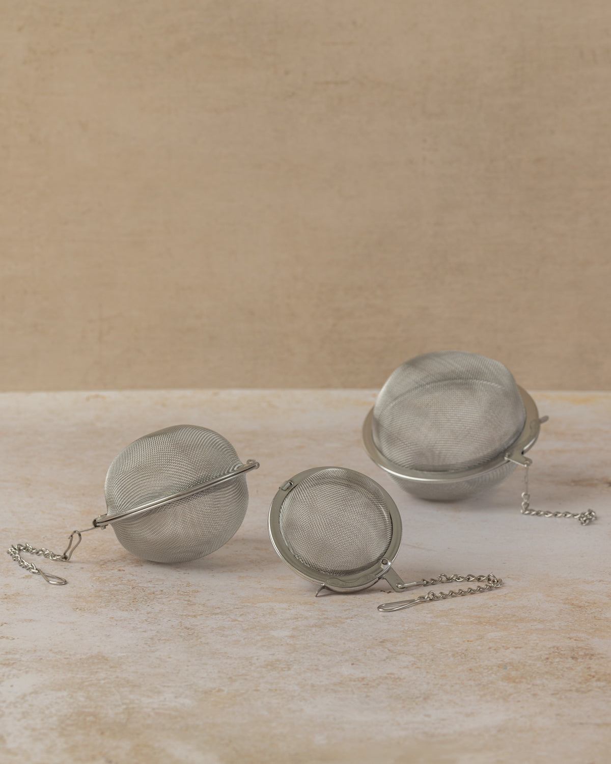 Stainless steel tea ball filters and chains in three sizes, by The Tea House 