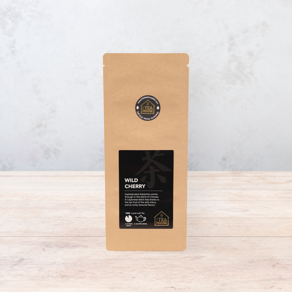 100g pack of black tea flavoured with wild cherry pieces, from The Tea House